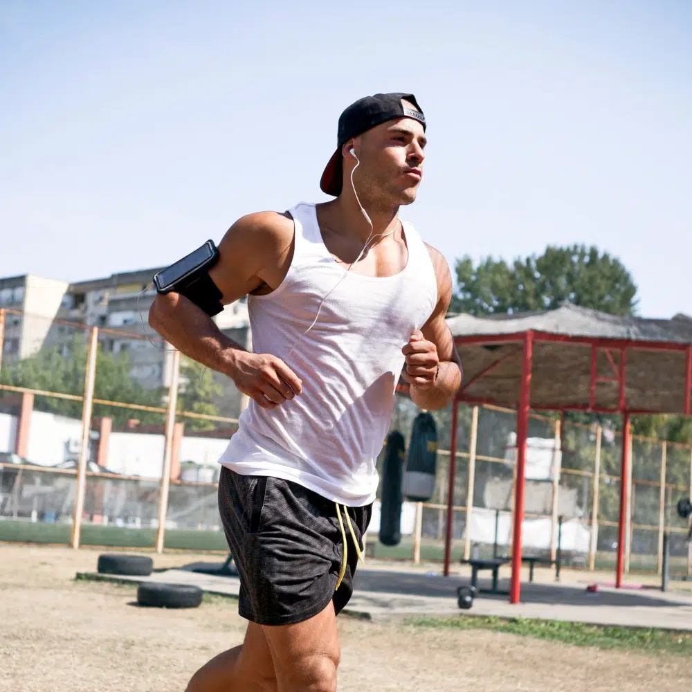 Person running on a treadmill for steady-state cardio.
