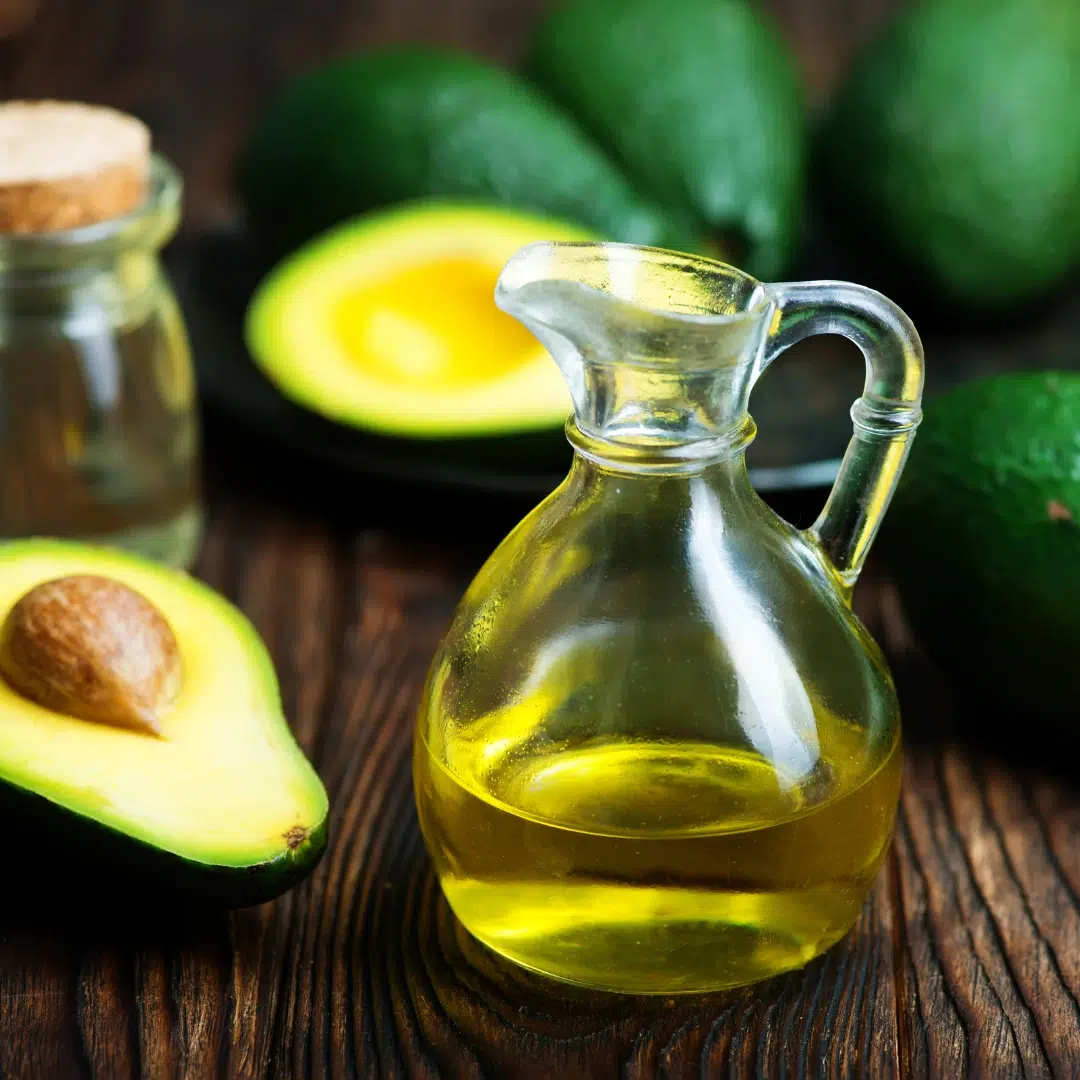 Avocado and olive oil offering healthy fats that support hormone production and reduce inflammation for estrogen balance.