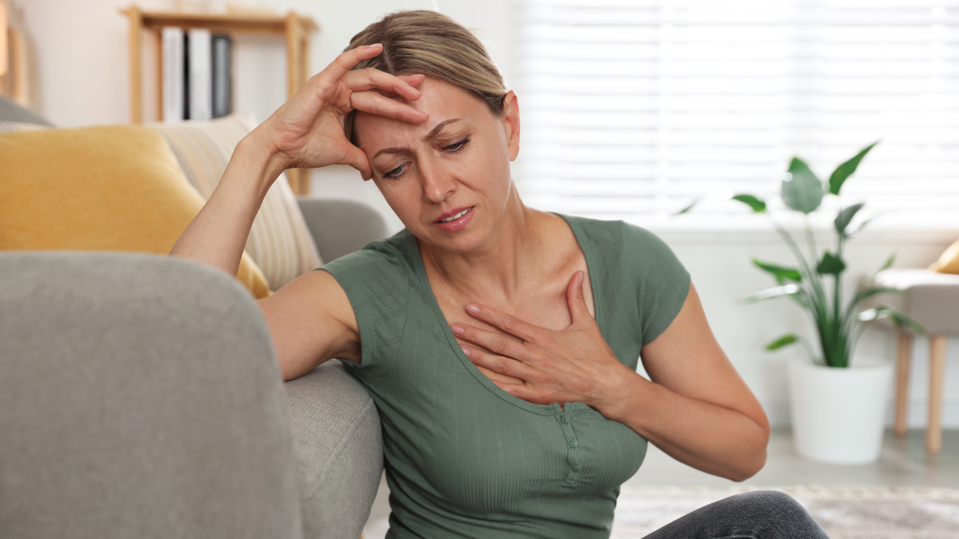 a woman experiencing hot flashes which is a most common symptom of menopause